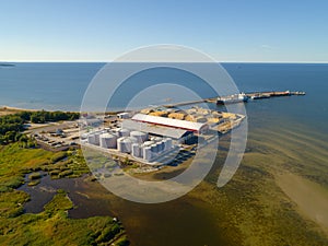 An aerial drone view of the industrial port in the Baltic Sea. Storage areas and tank fleet of the liquid chemicals terminal.
