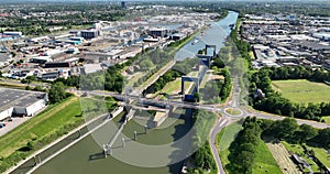 Aerial drone view of inland shipping sluice called Weurt, lock system infrastructure, The Netherlands.