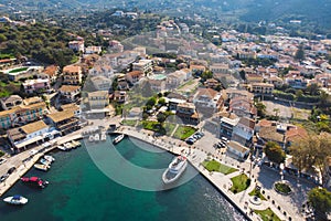 Aerial drone view of Kassiopi, village in northeast coast of Corfu island, Ionian Islands, Kerkyra, Greece in a summer sunny day,