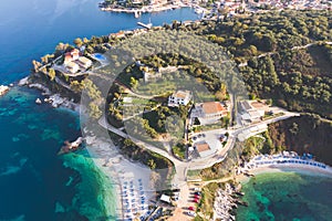 Aerial drone view of Kassiopi, village in northeast coast of Corfu island, Ionian Islands, Kerkyra, Greece in a summer sunny day,