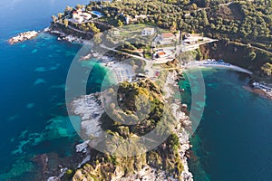 Aerial drone view of Kassiopi, village in northeast coast of Corfu island, Ionian Islands, Kerkyra, Greece in a summer sunny day,