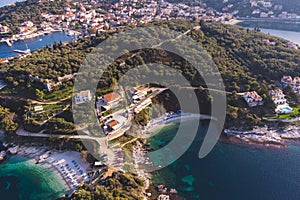 Aerial drone view of Kassiopi, village in northeast coast of Corfu island, Ionian Islands, Kerkyra, Greece in a summer sunny day,