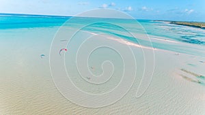 Aerial drone view of kite surfing lovers enjoying the sea in Jambiani Zanzibar photo