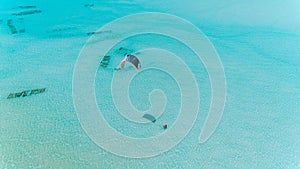 Aerial drone view of kite surfing lovers enjoying the sea in Jambiani Zanzibar photo