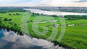 Aerial drone view of Kyiv cityscape, Dnieper and Dniester river, green island from above, Kiev city skyline and parks, Ukraine photo