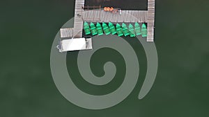 Aerial drone view of a lake boat dock. Flying above a vessel pier