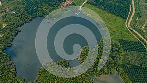 Aerial drone view of lake scenery at Tasik Biru Chinchin, Jasin, Melaka, Malaysia