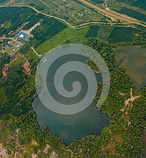 Aerial drone view of lake scenery at Tasik Biru Chinchin, Jasin, Melaka, Malaysia