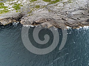 Aerial drone view, landscape in Burren region, county Clare Ireland. Mini cliffs and Atlantic ocean,