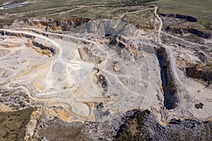 Aerial drone view of a limestone quarry, open pit mine