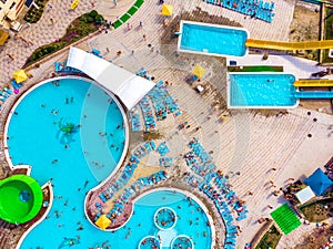 Aerial drone view looking straight down from above colorful summer time fun at water park