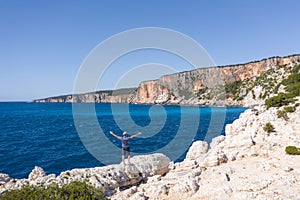 Aerial drone view of man enjoying rocky coastline close to Alaties Beach, Kefalonia, Ionian islands, Greece photo