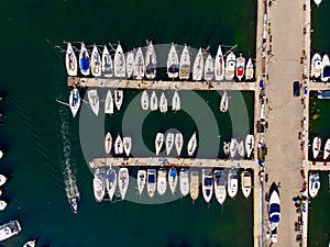 Aerial Drone View of Marina with Sailboats and Motor Boats Docked in Pier. photo