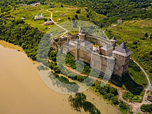 Aerial drone view of a medieval castle among the hills in summer