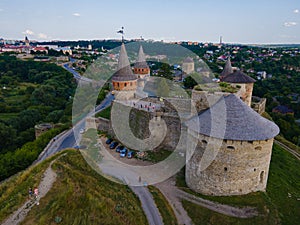 Aerial drone view of a medieval castle among the hills in summer