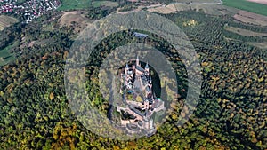 Aerial drone view of medieval Hohenzollern castle on top of hill in autumn, Baden-Wurttemberg, Germany