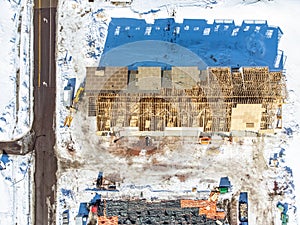 Aerial drone view of a multifamily apartment complex under construction.