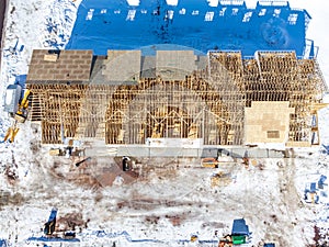 Aerial drone view of a multifamily apartment complex under construction.