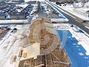 Aerial drone view of a multifamily apartment complex under construction.