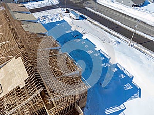 Aerial drone view of a multifamily apartment complex under construction.