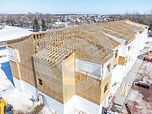 Aerial drone view of a multifamily apartment complex under construction.