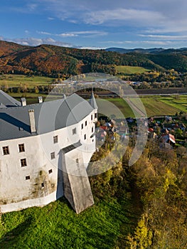 Aerial drone view from north of Slovenska Lupca castle during autumn sunset