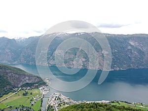 Aerial drone view of Norwegian fjord mountains Stegastein viewpoint above Orlandsfjord in Norwa