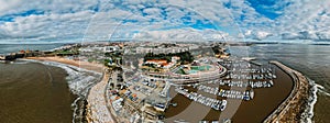 Aerial drone view of Oerias Marina and Carvavelos to the west and Paco do Arcos to the east, Lisbon, Portugal