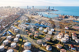 Aerial drone view of oil and gas terminal with steel storage tanks of oil and LPG petrochemical. Oil tank farm for gas