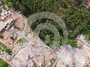 Aerial drone view of old demolished industrial building. Pile of concrete and brick rubbish, debris, rubble and waste of
