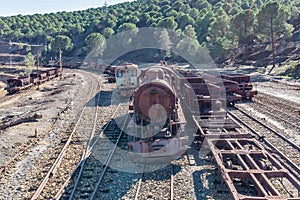 Aerial drone view of an old and rusty steam mining train used for transportation of the copper of Corta Atalaya mining exploitatio