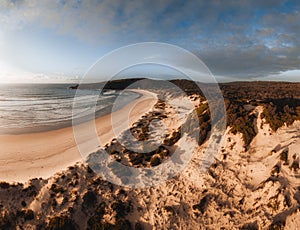 Aerial Drone view One Mile Beach during sunrise sunset with sand dunes. Forster, Great Lakes, Australia