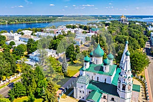 Aerial drone view of Orthodox Church of Elijah the Prophet, Assumption Cathedral, Strelka park and Volga river in summer of