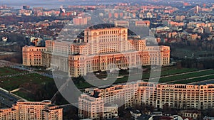 Aerial drone view of Palace of the Parliament in Bucharest downtown at sunset