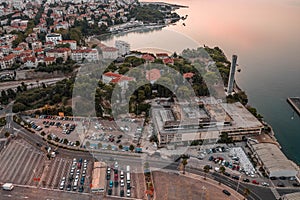 Aerial drone view of parking by ferry port pomoraca park before sunrise in morning in Croatia