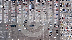 Aerial drone view of parking lot with many cars from above, city transportation