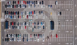 Aerial drone view of parking lot with many cars from above, city transportation