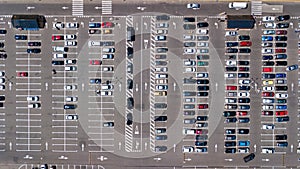 Aerial drone view of parking lot with many cars from above, city transportation