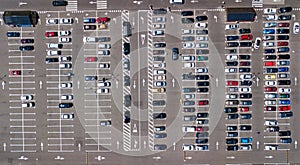 Aerial drone view of parking lot with many cars from above, city transportation