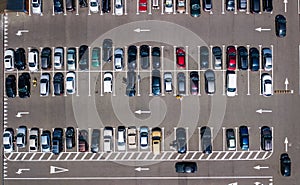 Aerial drone view of parking lot with many cars from above, city transportation