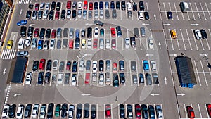 Aerial drone view of parking lot with many cars from above, city transportation