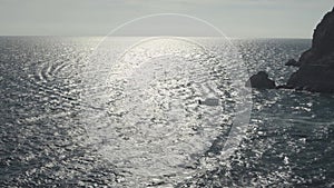 Aerial drone view of passenger small yacht cruising in popular Aegean sea. Shot. Slow motion effect, white ship floating