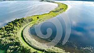 Aerial drone view of path on dam in polder water from above, landscape and nature of North Holland, Netherlands photo