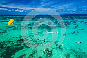 Aerial drone view of people enjoying water sports sea activities