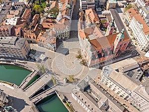 Aerial drone view of Preseren Squere and Triple Bridge over Ljubljanica river,Tromostovje, Ljubljana, Slovenia. Empty