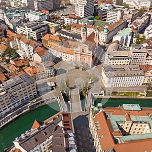 Aerial drone view of Preseren Squere and Triple Bridge over Ljubljanica river,Tromostovje, Ljubljana, Slovenia. Empty