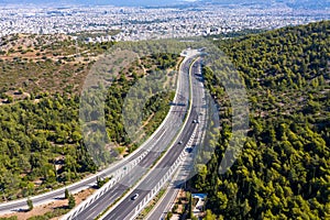 Aerial drone view of regional highway of Hymettus mountain, Greece, Athens city background
