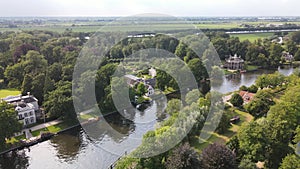 Aerial drone view of the river Nes Stichtse Vecht between Amsterdam and Utrecht with historic houses villa, along the