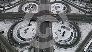 Aerial drone view of road junction, large car interchange. Aerial highway junction at winter evening, Colorcorrected 4k