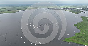 Aerial drone view of sailing boats, leisure activity in Friesland, The Netherlands.